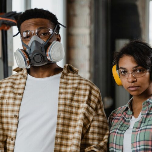 A man and woman in protective gear |Indoor Air Quality | home air quality testing